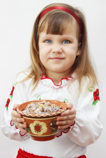 Bir tabak kutia ile tutan kız — Stok fotoğraf