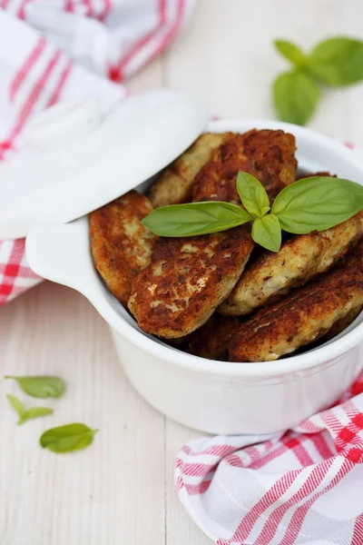 Fish cutlets countrylike in ceramic saucepan — Stock Photo, Image