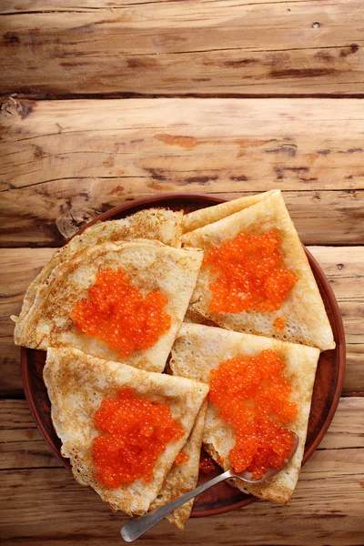 Pancakes with red caviar at home — Stock Photo, Image