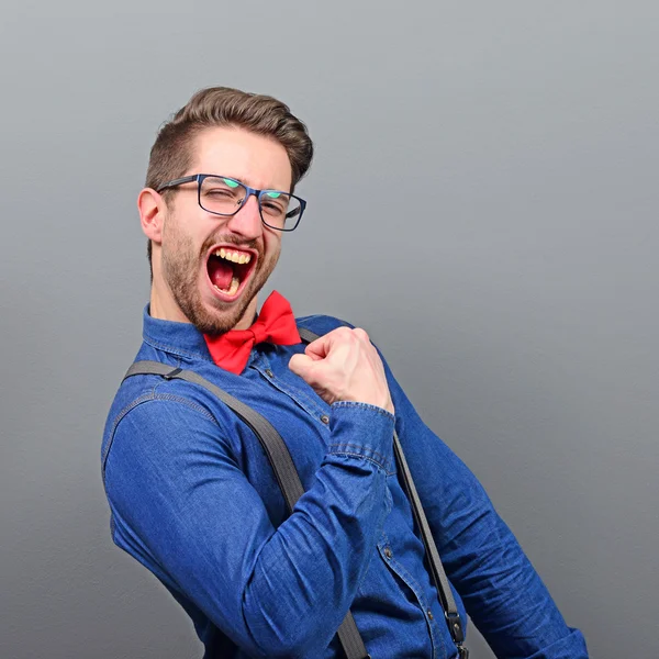 Portrait of ecstatic young man celebrating victory or win agains — Stock Photo, Image