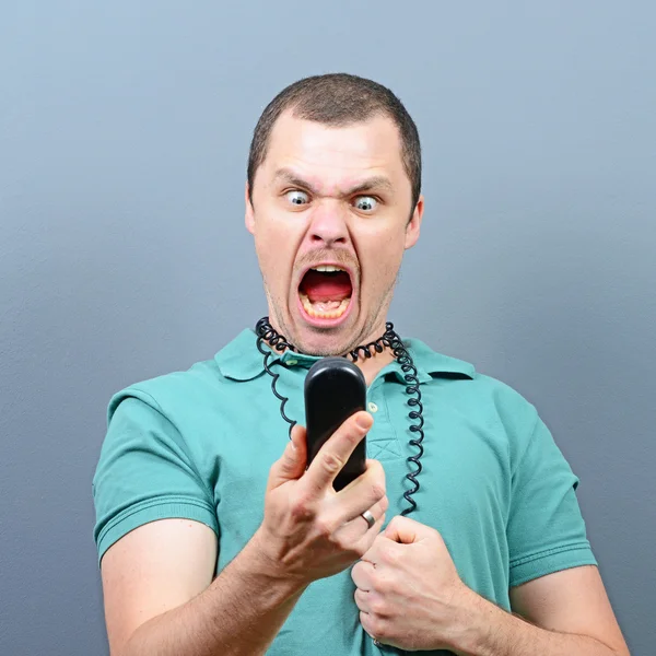 Man having unpleasant conversation on telephone — Stock Photo, Image