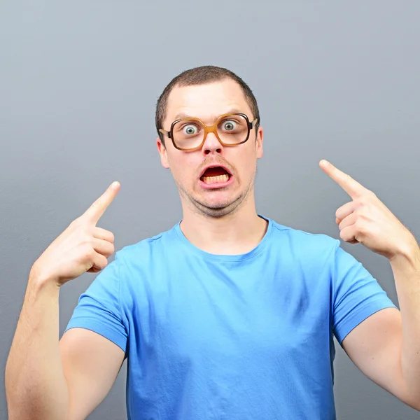 Portrait of angry nerd with huge glasses — Stock Photo, Image