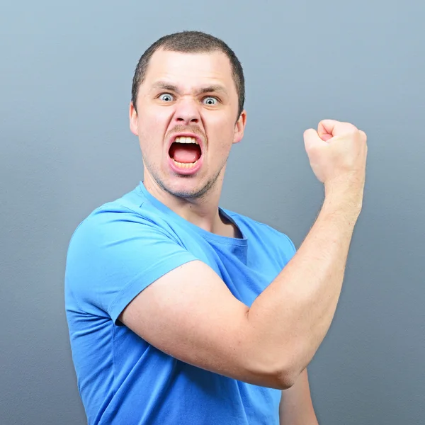 Portrait of ecstatic young man celebrating victory or win agains — Stock Photo, Image