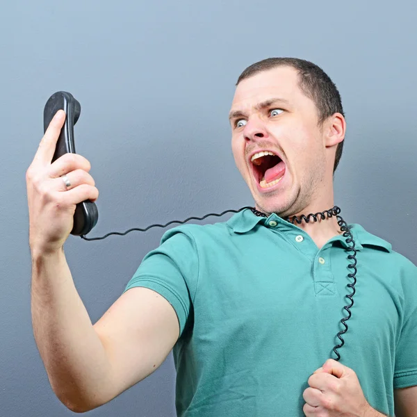 Man having unpleasant conversation on telephone Royalty Free Stock Photos