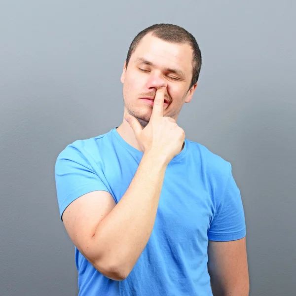 Man putting finger deep in his nose - Bad habit concept Royalty Free Stock Photos