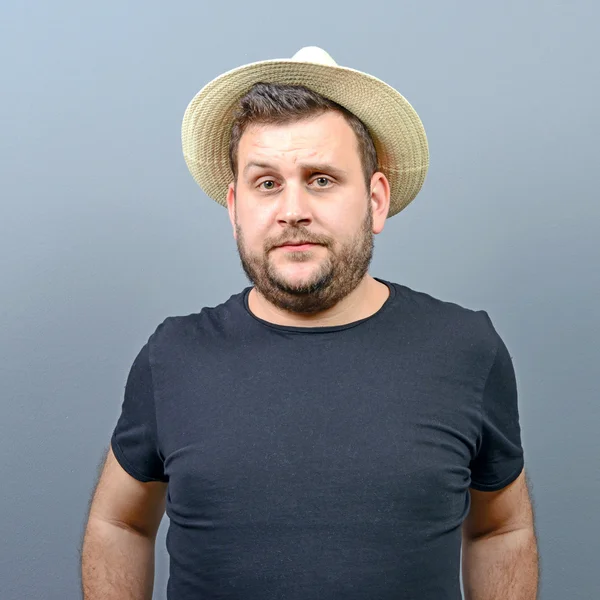 Portrait of funny chubby man wearing straw hat — Stock Photo, Image