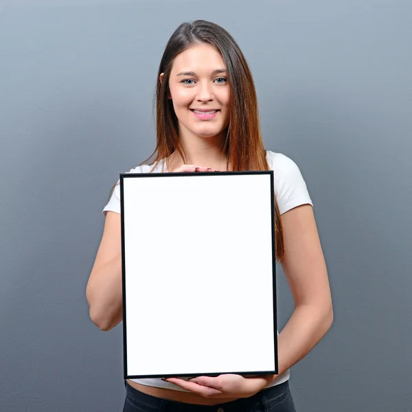 Woman holding empty frame with space for your advertisement agai — Stock Photo, Image