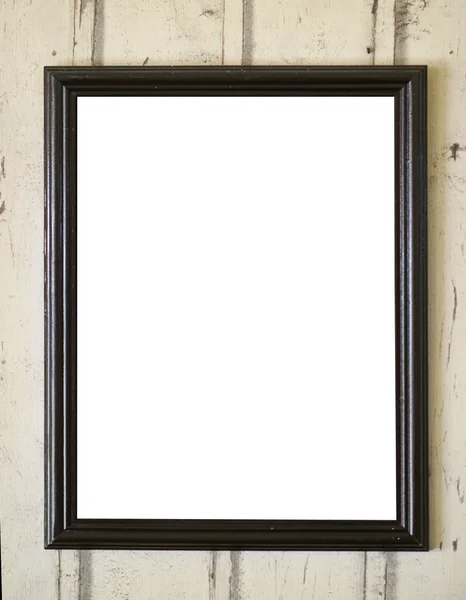 Empty photo frame hanging on wooden wall — Stock Photo, Image