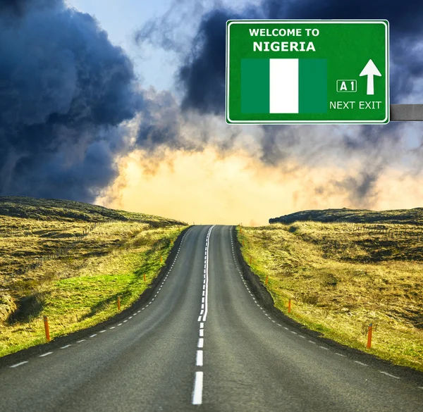 Nigeria road sign against clear blue sky — Stock Photo, Image