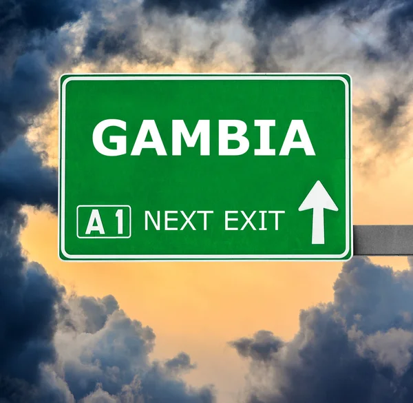 GAMBIA road sign against clear blue sky