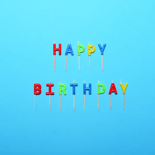 Happy Birthday flat lay party decorations on blue background — Stock Photo, Image