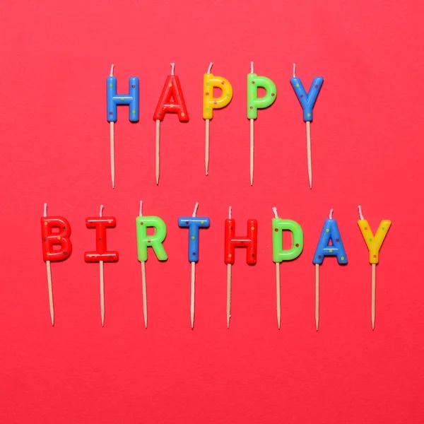 Happy Birthday flat lay party decorations on red background — Stock Photo, Image