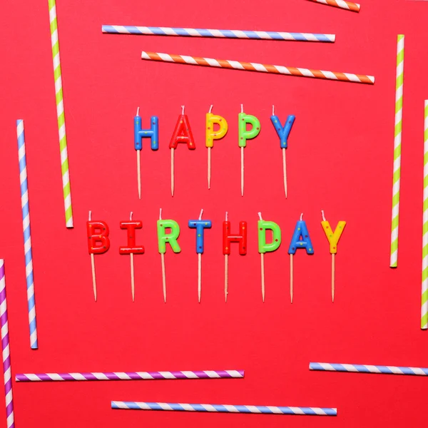 Happy Birthday flat lay party decorations on red background — Stock Photo, Image