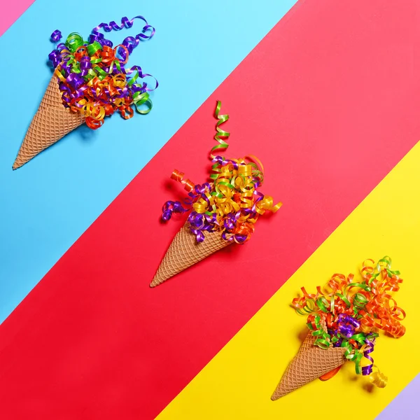 Ice cream cones with colorful confetti on colorful background - — Stock Photo, Image