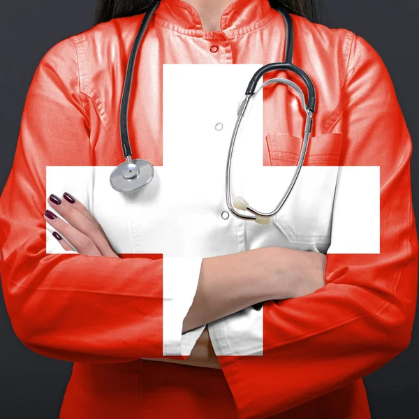 Doctor representing healthcare system with National flag of Switzerland