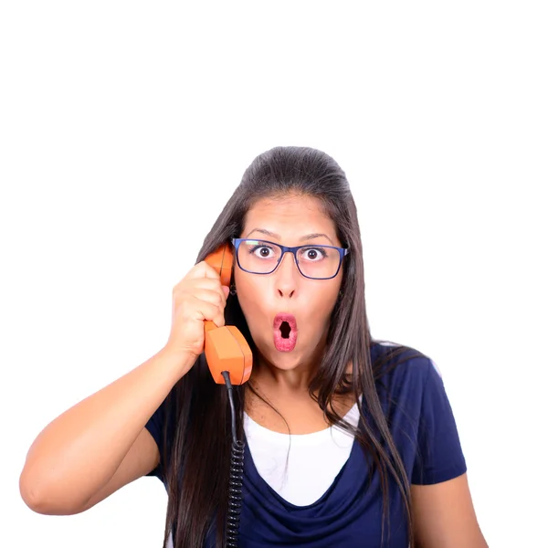 Portrait of young female in shock while talking on phone having — Stock Photo, Image