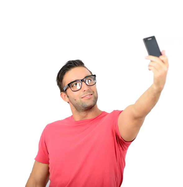Closeup of young handsome man looking at smartphone and taking s — Stock Photo, Image