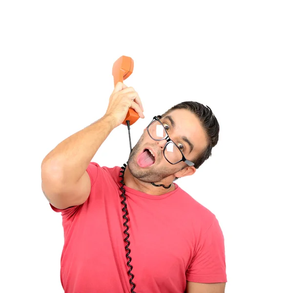 Handsome man talking on retro telephone with wire around his nec — Stock Photo, Image