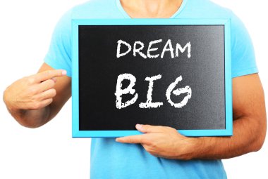 Blackboard elinde tutan ve büyük kelime rüya işaret eden adam