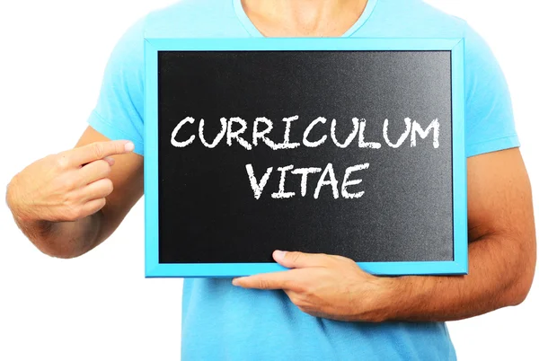 Man holding blackboard in hands and pointing the word CURRICULUM — Stock Photo, Image