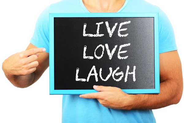 Man holding blackboard in hands and pointing the word LIVE LOVE — Stock Photo, Image