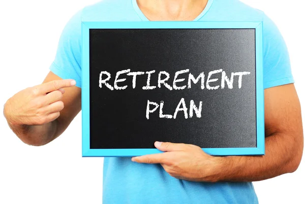 Man holding blackboard in hands and pointing the word RETIREMENT — Stock Photo, Image