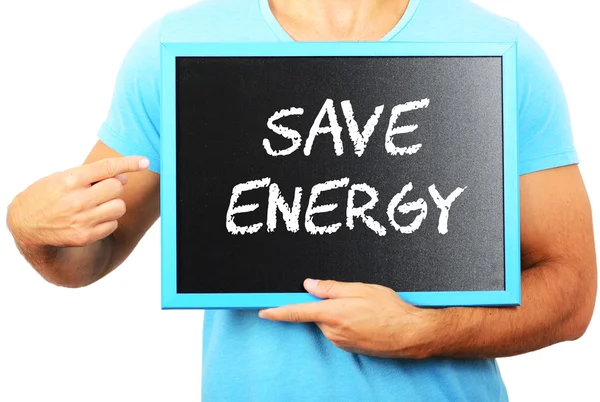 Человек, держащий доску в руках и указывающий слово SAVE ENERG — стоковое фото