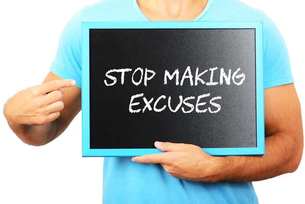 Man holding blackboard in hands and pointing the word STOP MAKIN — Stock Photo, Image