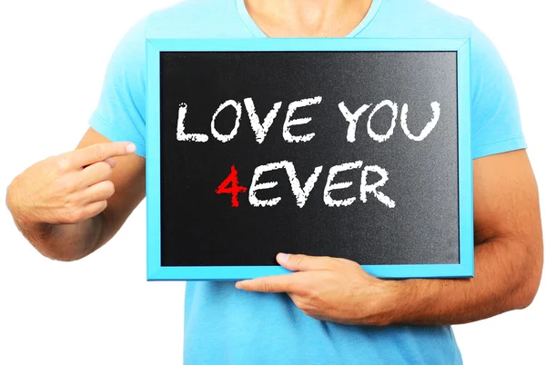 Man holding blackboard in hands and pointing the word LOVE YOU F — Stock Photo, Image