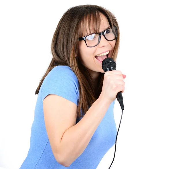 Portrait of a young female with microphone against white backgro — Stock Photo, Image