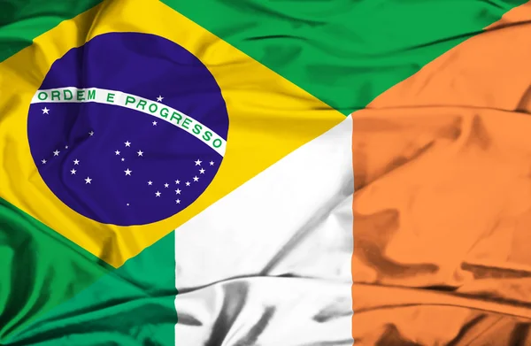 Waving flag of Ireland and Brazil — Stock Photo, Image