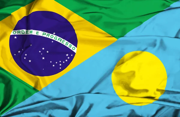 Waving flag of Palau and Brazil — Stock Photo, Image