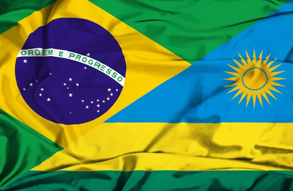 Bandeira acenando de Ruanda e Brasil — Fotografia de Stock