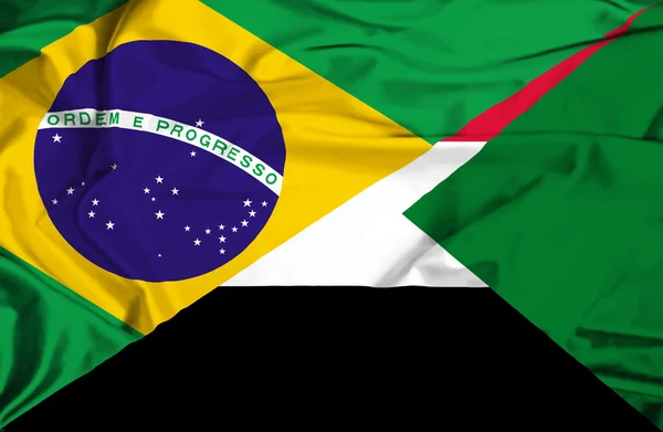 Waving flag of Sudan and Brazil — Stock Photo, Image
