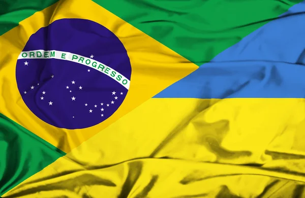 Waving flag of Ukraine and Brazil — Stock Photo, Image