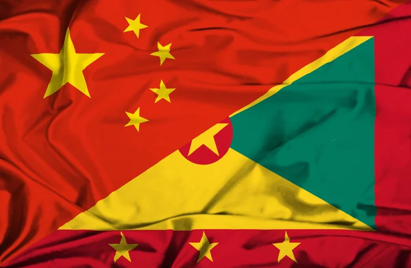 Flagge von Guernsey und China schwenken — Stockfoto