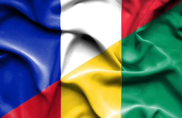 Waving flag of Guinea and France — Stock Photo, Image