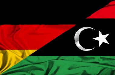 Libya ve Almanya bayrağı sallayarak