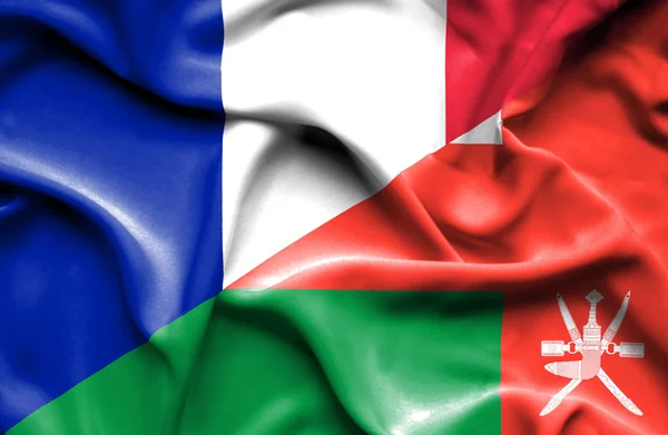Bandeira ondulada de Omã e França — Fotografia de Stock