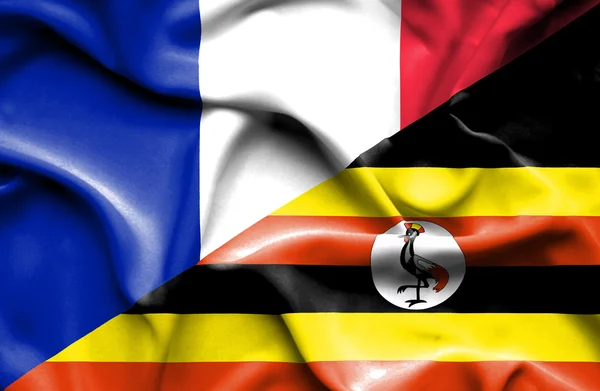 Bandeira acenando de Uganda e França — Fotografia de Stock