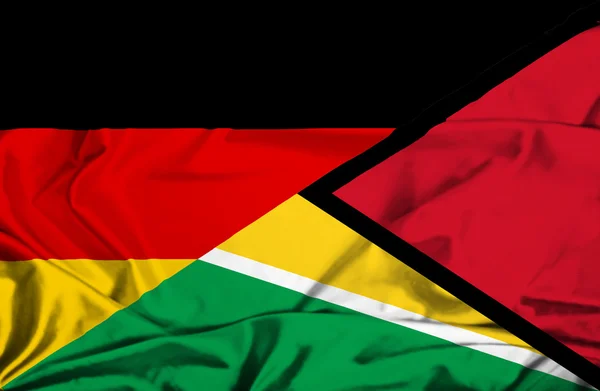 Wapperende vlag van Guyana en Duitsland — Stockfoto