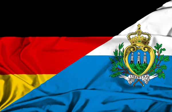 Waving flag of San Marino and Germany — Stock Photo, Image