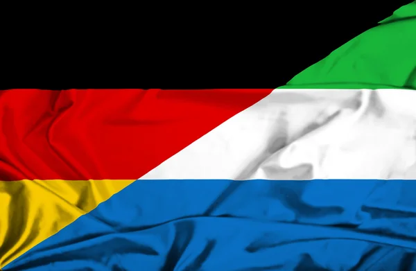 Waving flag of Sierra Leone and Germany — Stock Photo, Image