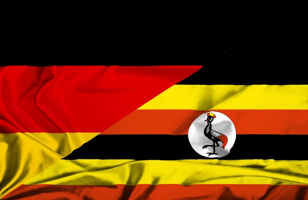 Wapperende vlag van Oeganda en Duitsland — Stockfoto