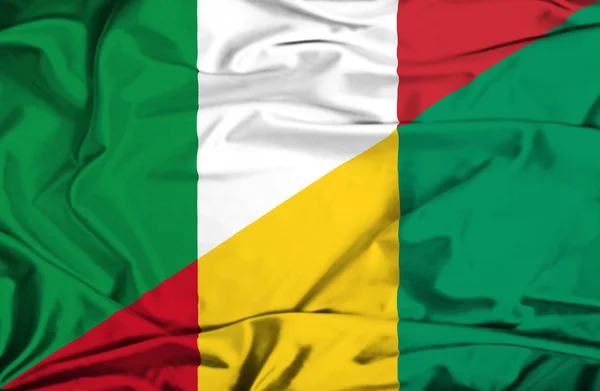 Waving flag of Guinea and Italy — Stock Photo, Image