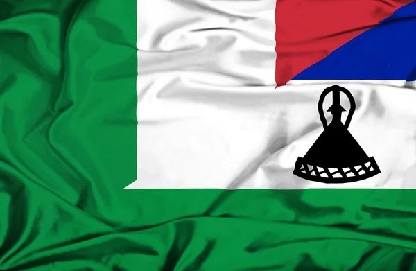 Waving flag of Lesotho and Italy — Stock Photo, Image
