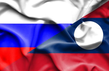 laos ve Rusya bayrağı sallayarak