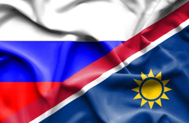 Namibya ve Rusya bayrağı sallayarak