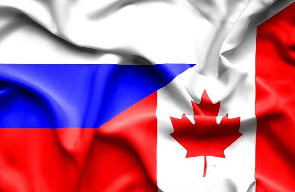 Flagge Kanadas und Russlands schwenken — Stockfoto