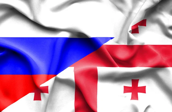 Bandeira ondulada da Geórgia e da Rússia — Fotografia de Stock